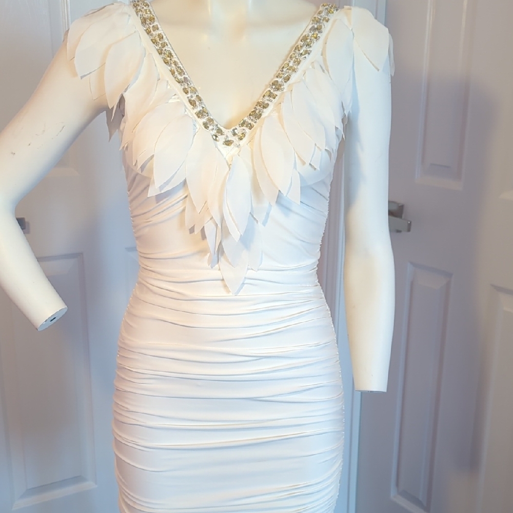 Elegant White Dress with Leaf Detailing and Bead Embellishment